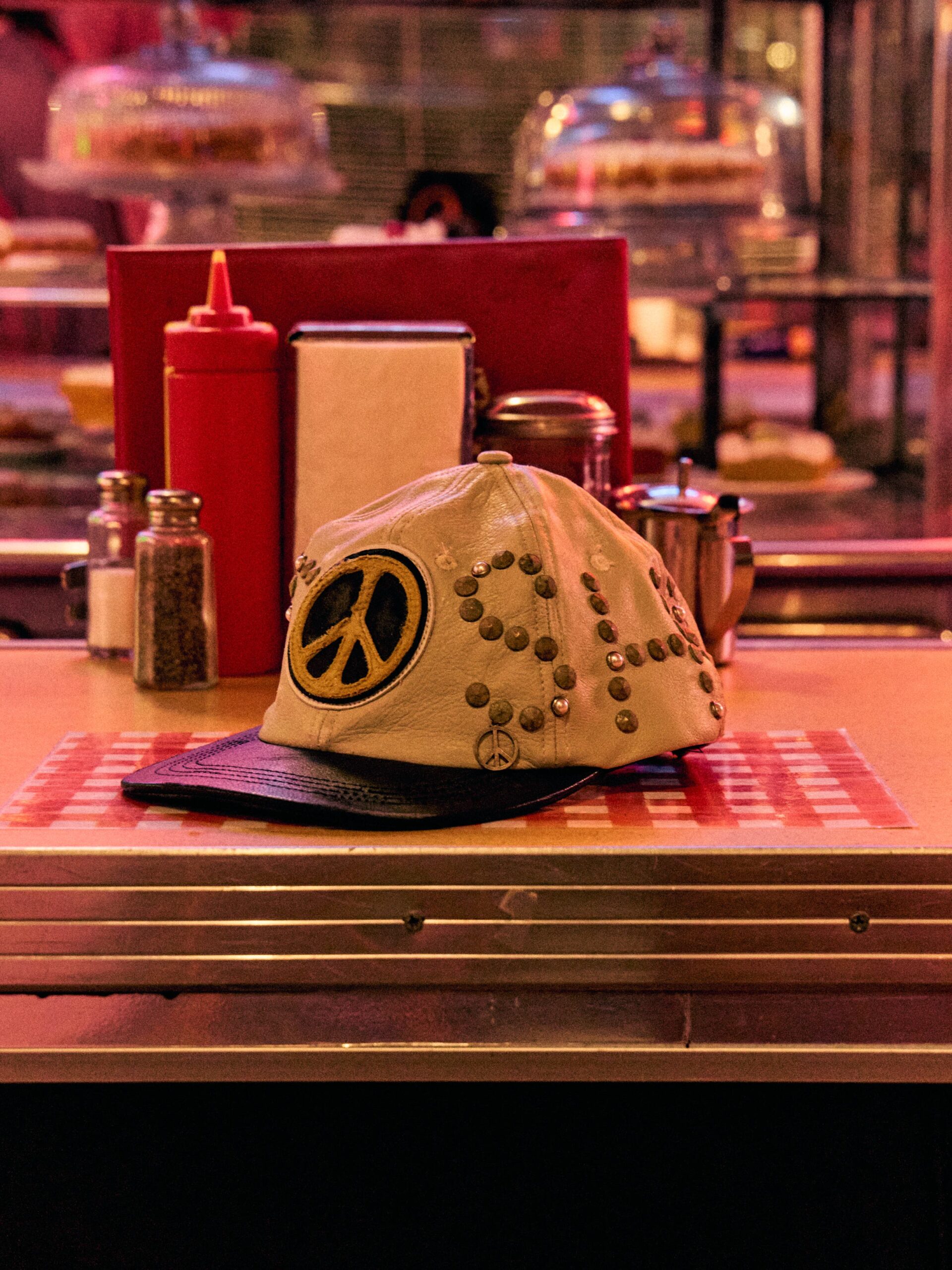 SATOSHI NAKAMOTO STUDDED WRAP AROUND LEATHER CAP